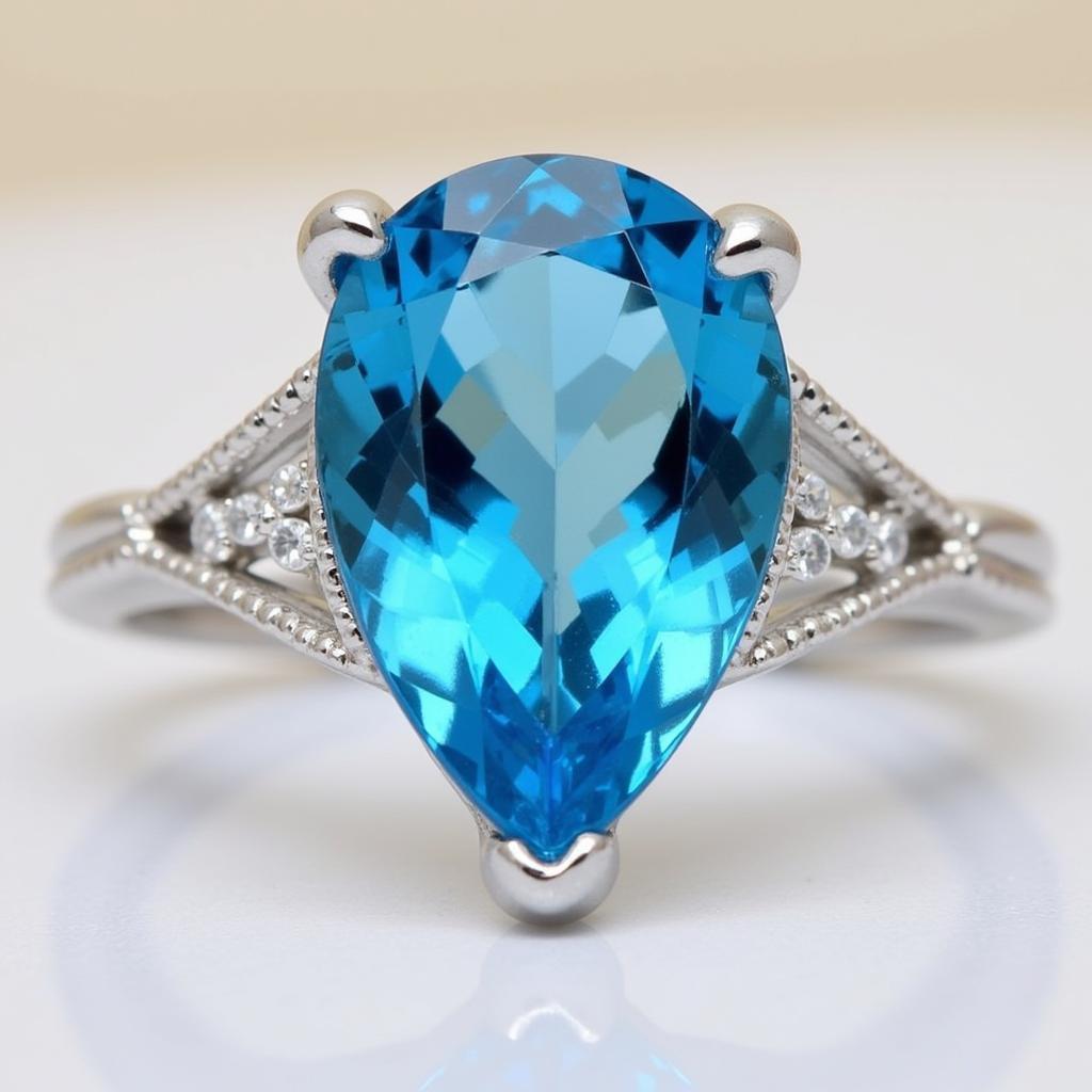 Nhẫn đính hôn đá Topaz xanh